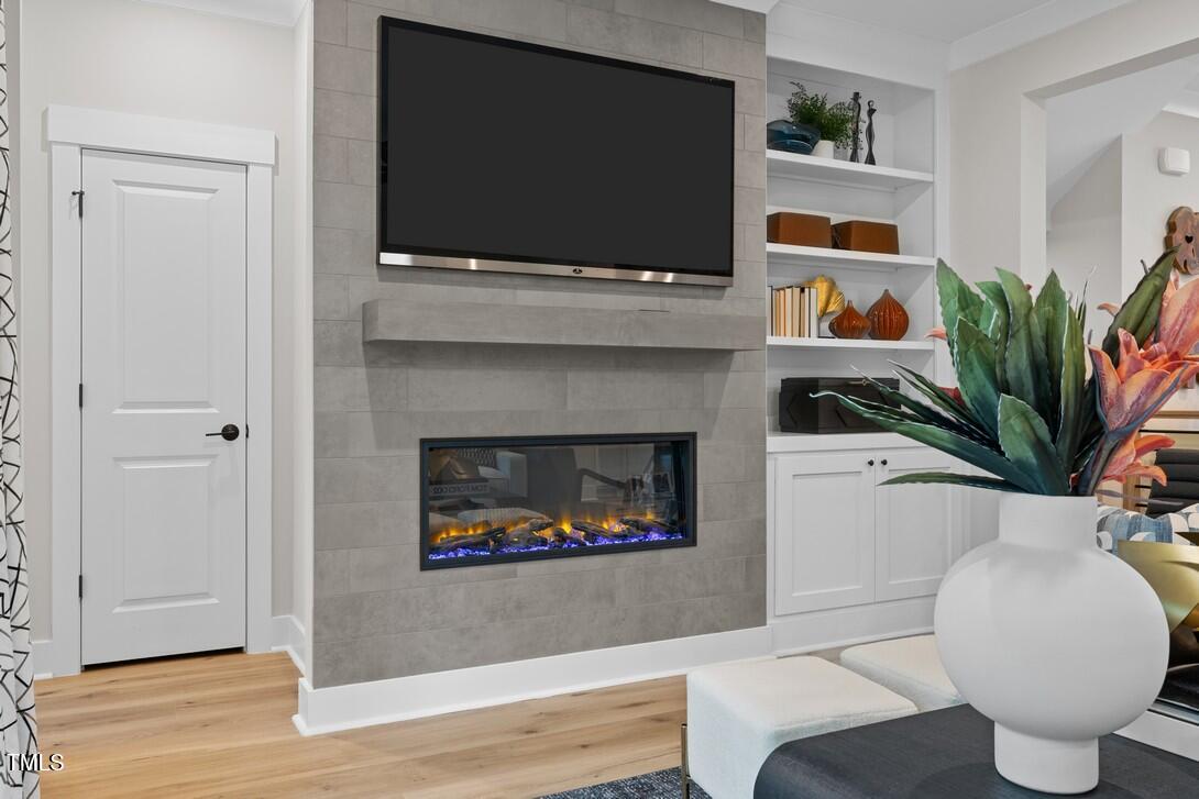 4713 Mint Leaf Lane Raleigh, NC 27612 - Photo 22 of 43 a living room with furniture and a flat screen tv