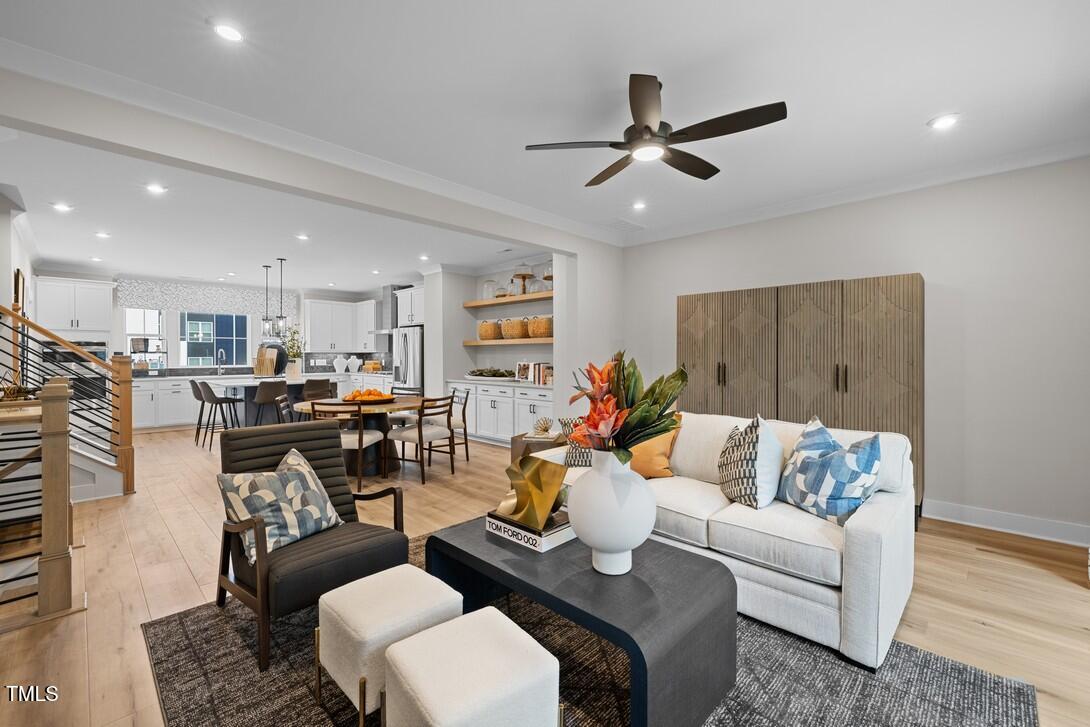 4713 Mint Leaf Lane Raleigh, NC 27612 - Photo 24 of 43 a living room with furniture and kitchen view