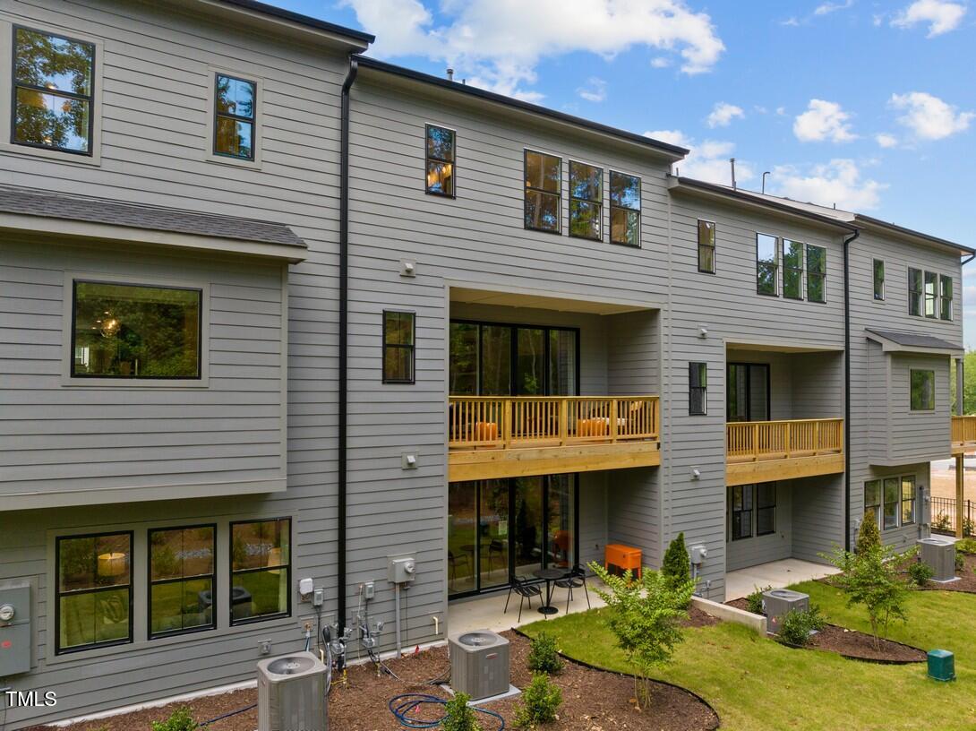 4713 Mint Leaf Lane Raleigh, NC 27612 - Photo 3 of 43 a front view of a house with garden and porch