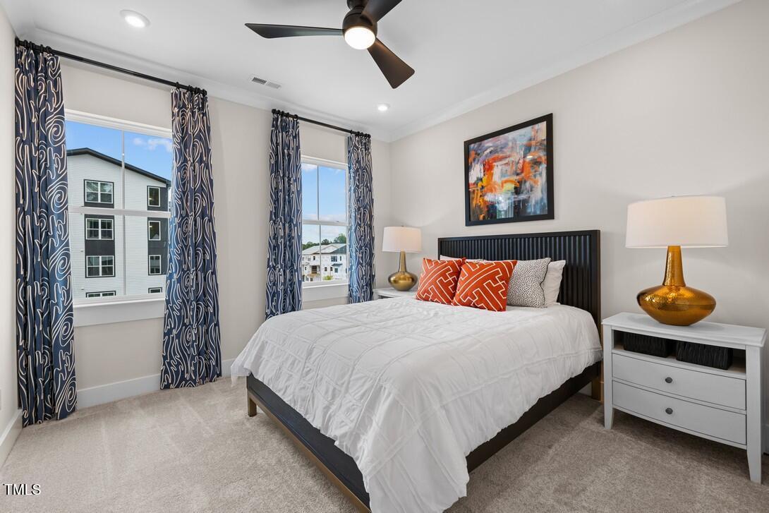 4713 Mint Leaf Lane Raleigh, NC 27612 - Photo 31 of 43 a bedroom with bed and window