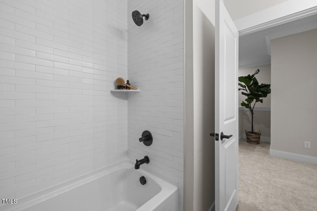 4713 Mint Leaf Lane Raleigh, NC 27612 - Photo 33 of 43 a bathroom with a tub