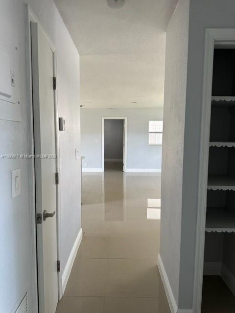 1472 Northeast 62nd Street, Unit 1472 Fort Lauderdale, FL 33334 - Photo 12 of 19 a view of a hallway