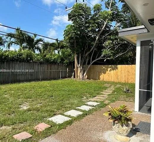 1472 Northeast 62nd Street, Unit 1472 Fort Lauderdale, FL 33334 - Photo 16 of 19 a view of a back yard