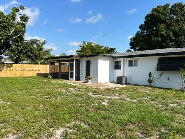 1472 Northeast 62nd Street, Unit 1472 Fort Lauderdale, FL 33334 - Photo 17 of 19 a house view with a garden space
