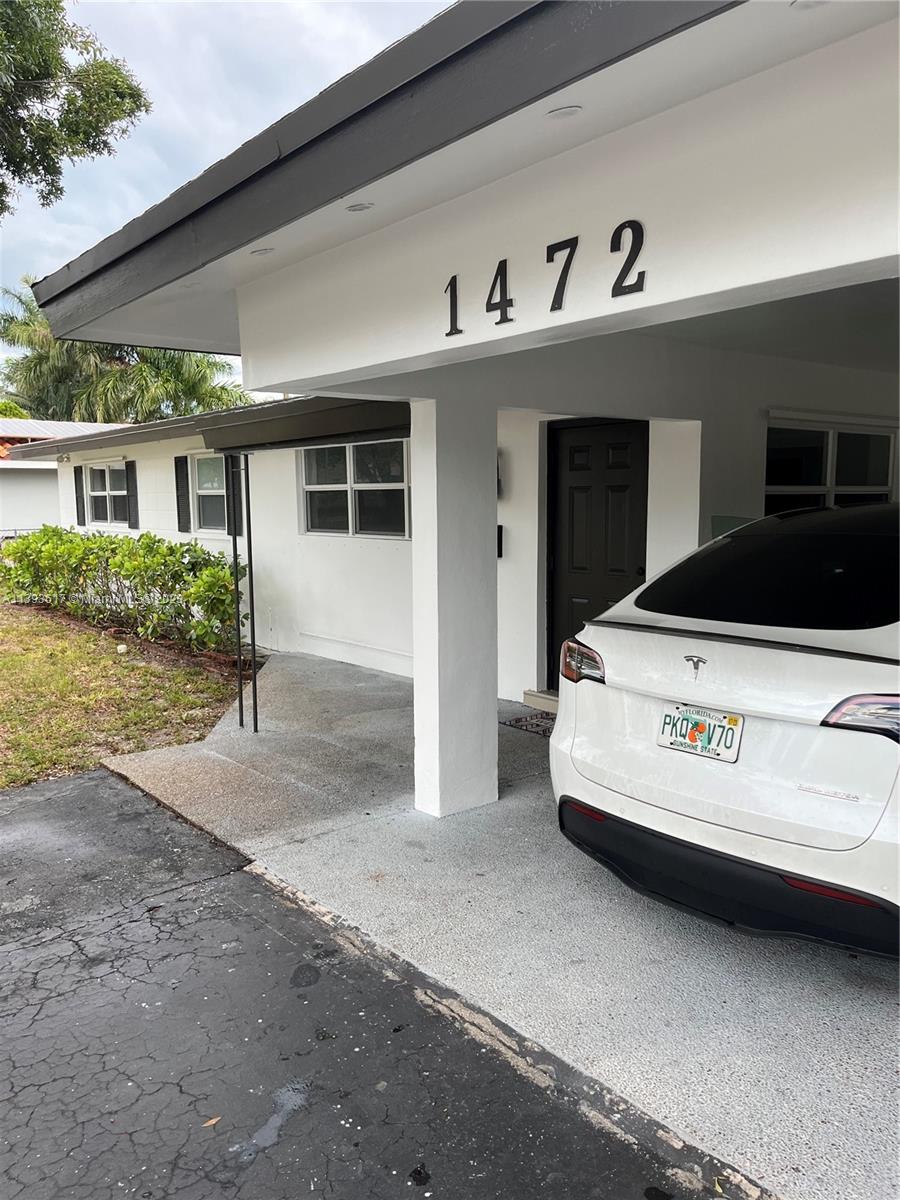 1472 Northeast 62nd Street, Unit 1472 Fort Lauderdale, FL 33334 - Photo 19 of 19 a car parked in front of house