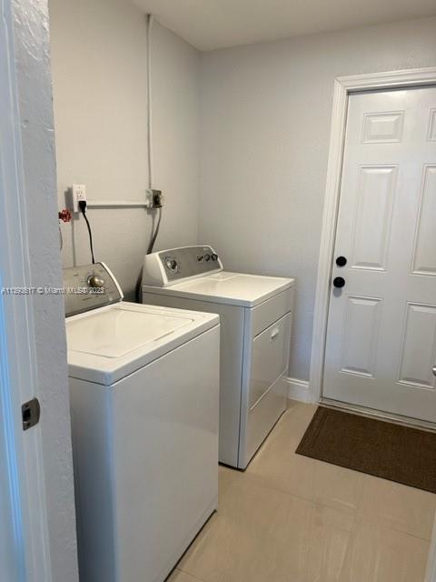 1472 Northeast 62nd Street, Unit 1472 Fort Lauderdale, FL 33334 - Photo 6 of 19 a utility room with dryer and washer