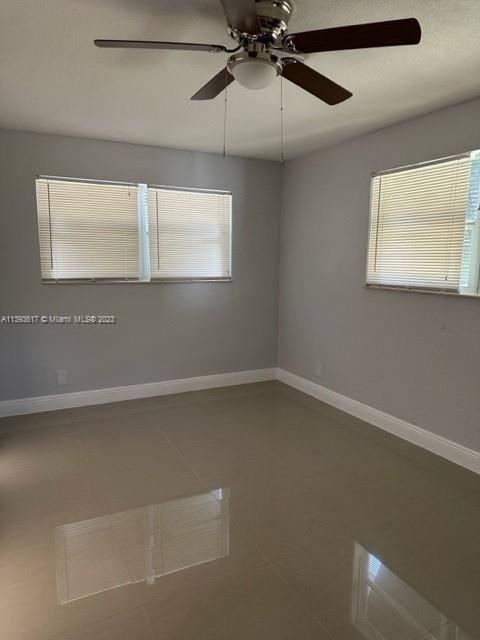 1472 Northeast 62nd Street, Unit 1472 Fort Lauderdale, FL 33334 - Photo 7 of 19 a view of an empty room with a window