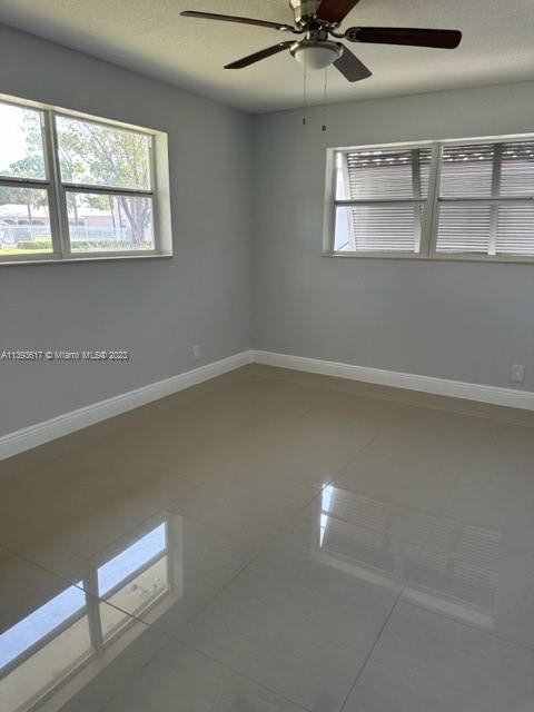 1472 Northeast 62nd Street, Unit 1472 Fort Lauderdale, FL 33334 - Photo 8 of 19 an empty room with a window