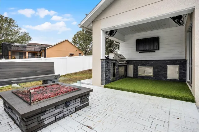 a view of a backyard with sitting area