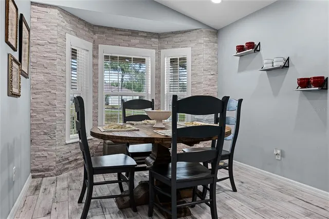 a dining room with furniture and window