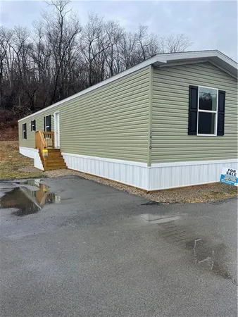 a view of a back yard of the house