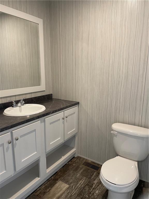 1410 A Hidden Valley Road Bulger, PA 15019 - Photo 11 of 13 a bathroom with a granite countertop toilet a sink and mirror