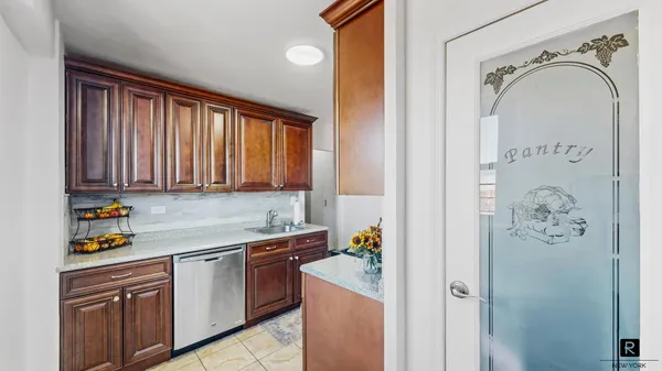 a kitchen with stainless steel appliances granite countertop a sink and cabinets