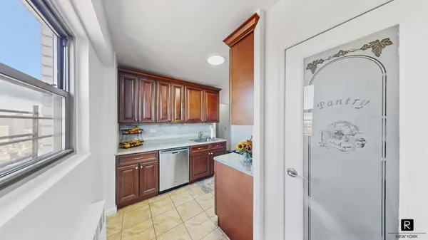 a view of a storage and utility room with a window