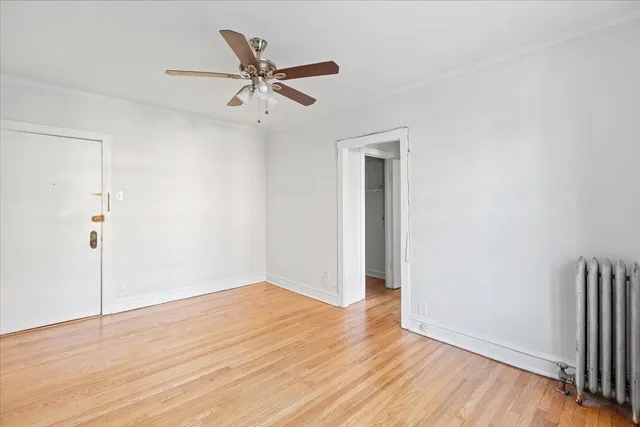 a view of a room with wooden floor