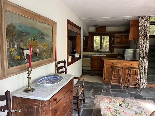 398 Rhoades And Bailey Road New Marlborough, MA 01259 - Photo 8 of 18 a kitchen with stainless steel appliances granite countertop a sink and a stove