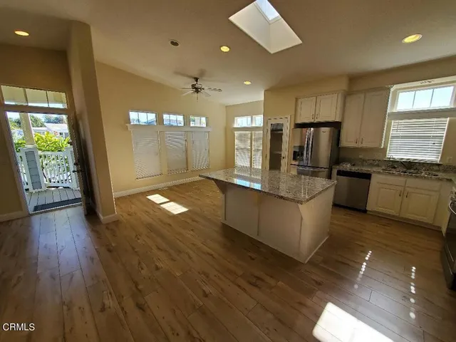 a bathroom with a double vanity sink mirror and shower
