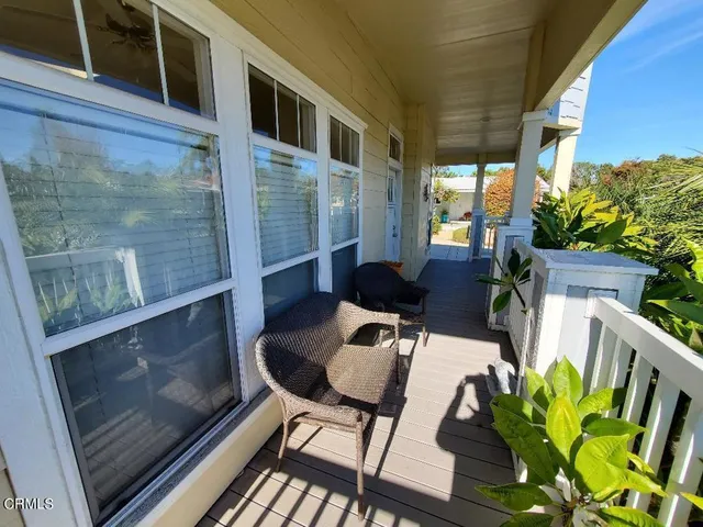 a view of a entryway door and wooden floor