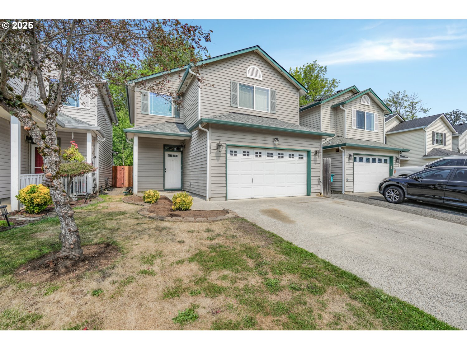 1512 Southwest 5th Street Battle Ground, WA 98604 - Photo 1 of 25 a front view of a house with a garden