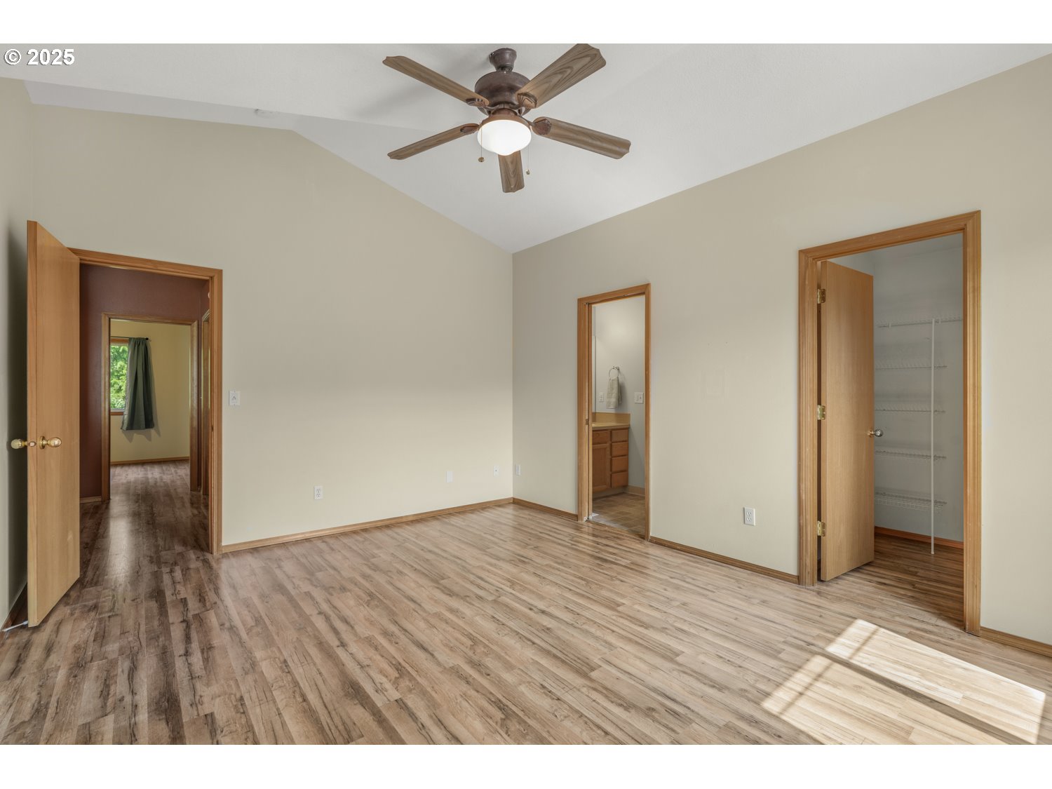 1512 Southwest 5th Street Battle Ground, WA 98604 - Photo 12 of 25 an empty room with wooden floor and a ceiling fan