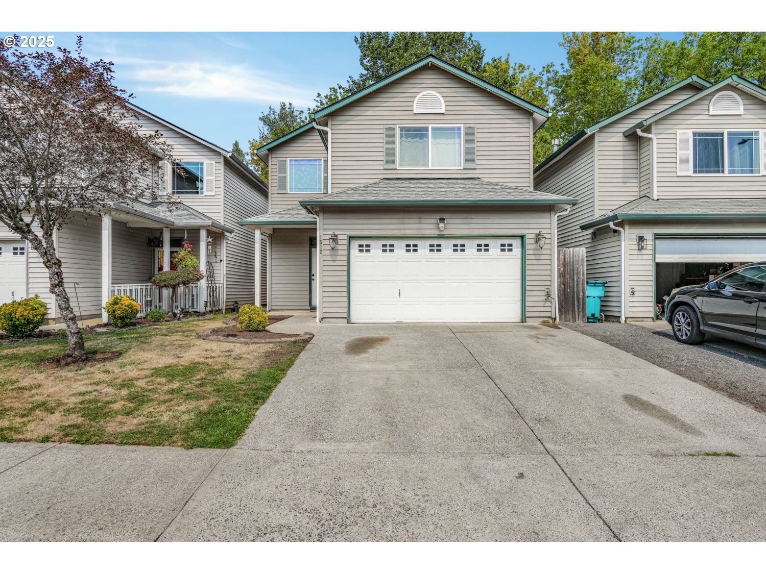 1512 Southwest 5th Street Battle Ground, WA 98604 - Photo 15 of 25 a view of a white house with a small yard and large tree