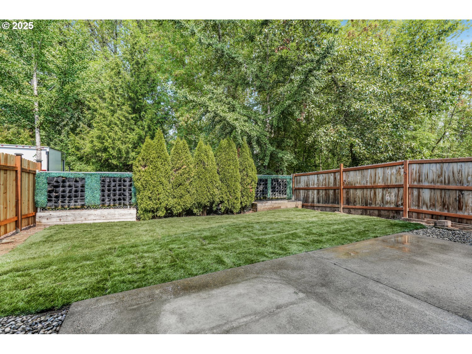 1512 Southwest 5th Street Battle Ground, WA 98604 - Photo 19 of 25 a view of a deck with a big yard and large trees