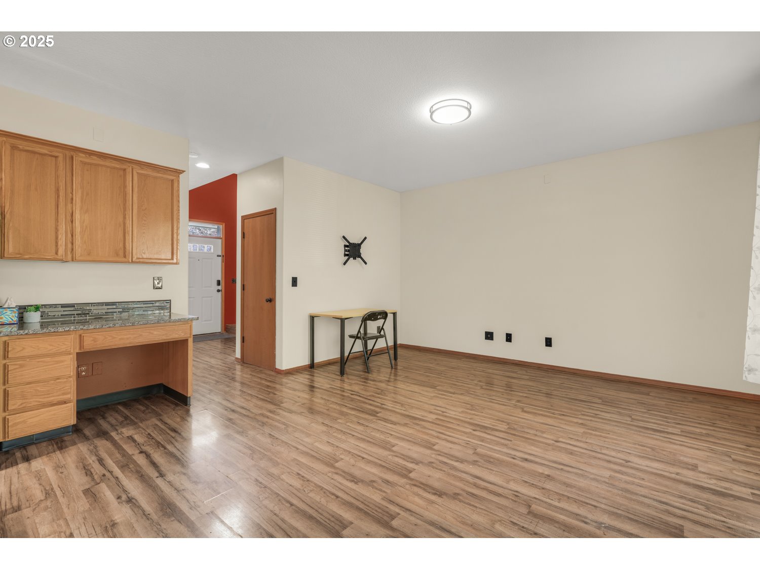 1512 Southwest 5th Street Battle Ground, WA 98604 - Photo 3 of 25 a view of an empty room with wooden floor and a window