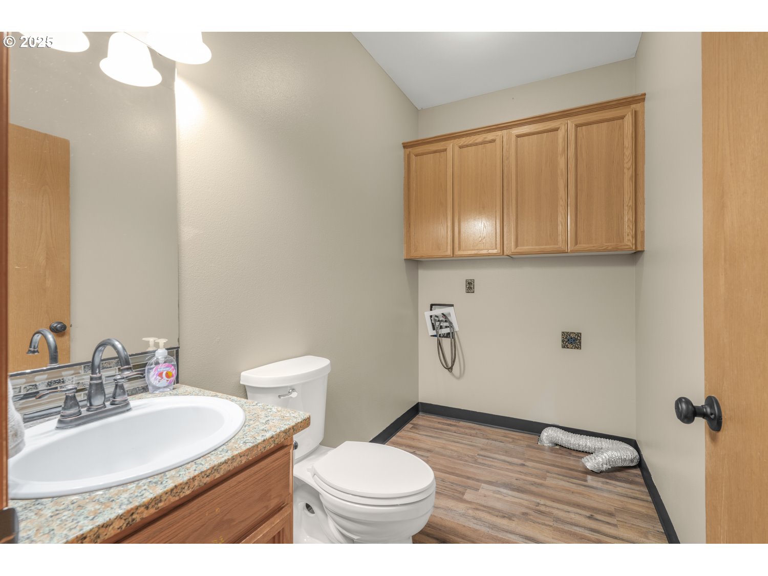 1512 Southwest 5th Street Battle Ground, WA 98604 - Photo 7 of 25 a bathroom with a sink a toilet and mirror
