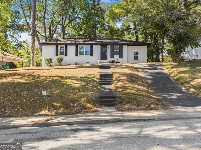 a view of house with a swimming pool
