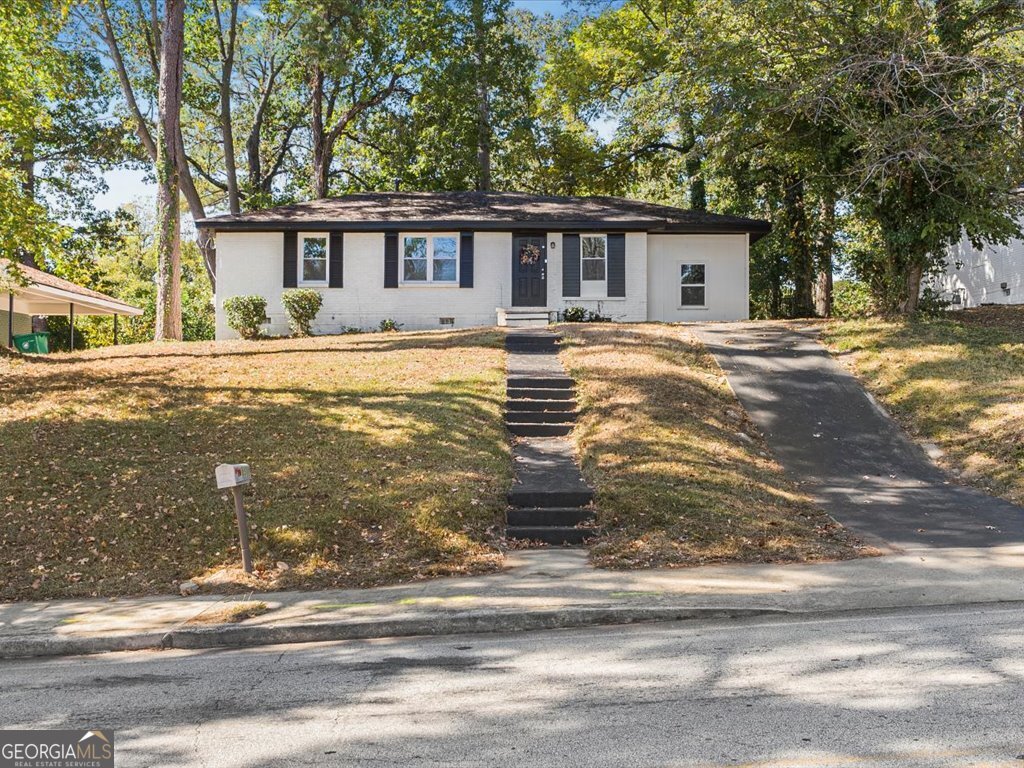 2905 Gresham Rd S East Atlanta, GA 30316 - Photo 1 of 27 a view of house with a swimming pool