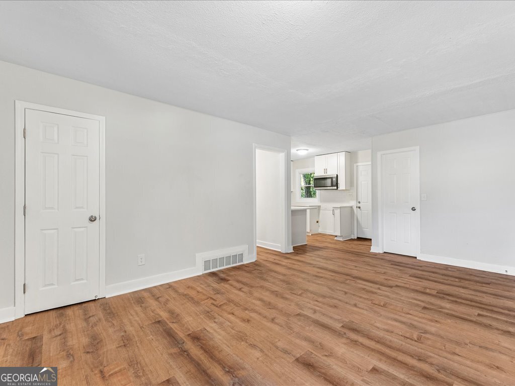 2905 Gresham Rd S East Atlanta, GA 30316 - Photo 13 of 27 a view of empty room with wooden floor