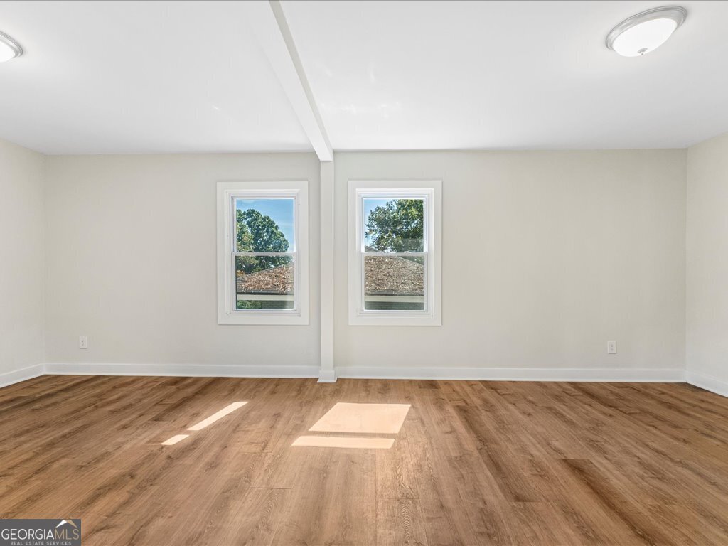 2905 Gresham Rd S East Atlanta, GA 30316 - Photo 16 of 27 a view of empty room with wooden floor and fan