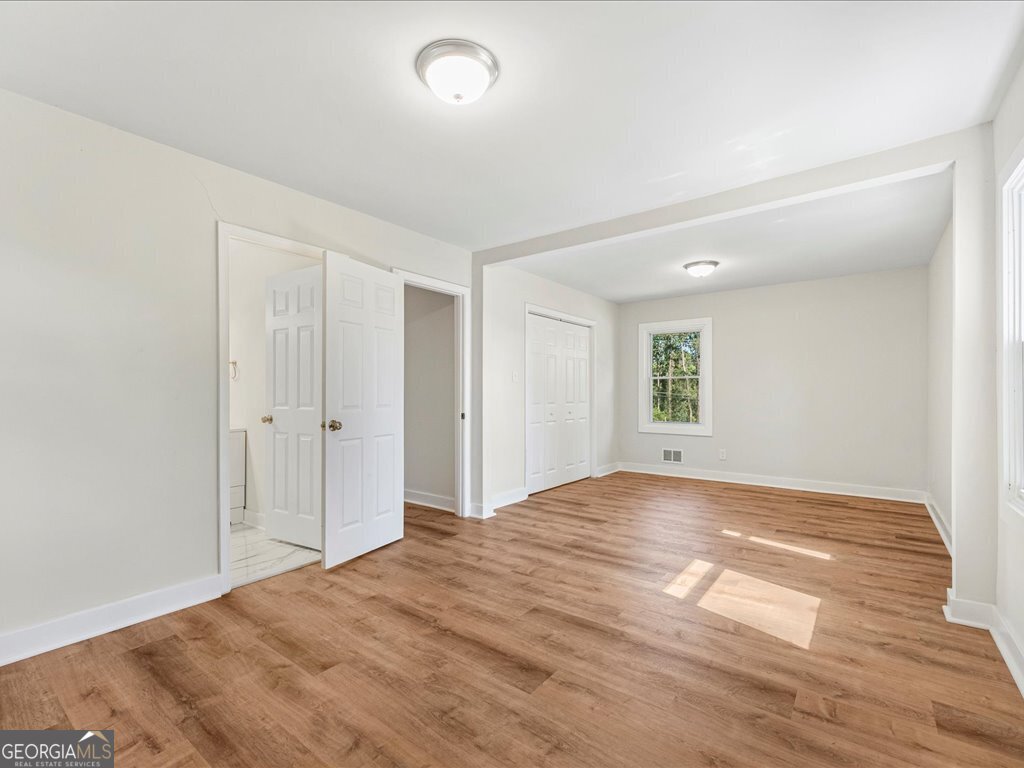 2905 Gresham Rd S East Atlanta, GA 30316 - Photo 17 of 27 a view of empty room with wooden floor and fan