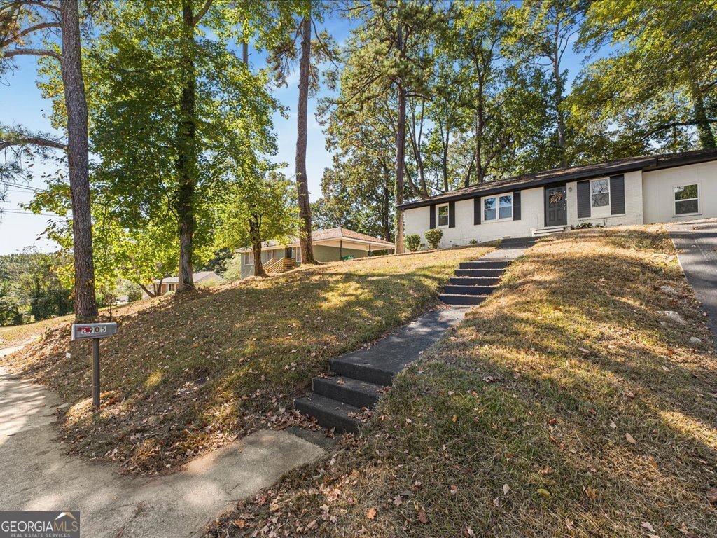 2905 Gresham Rd S East Atlanta, GA 30316 - Photo 2 of 27 a front view of a house with a yard