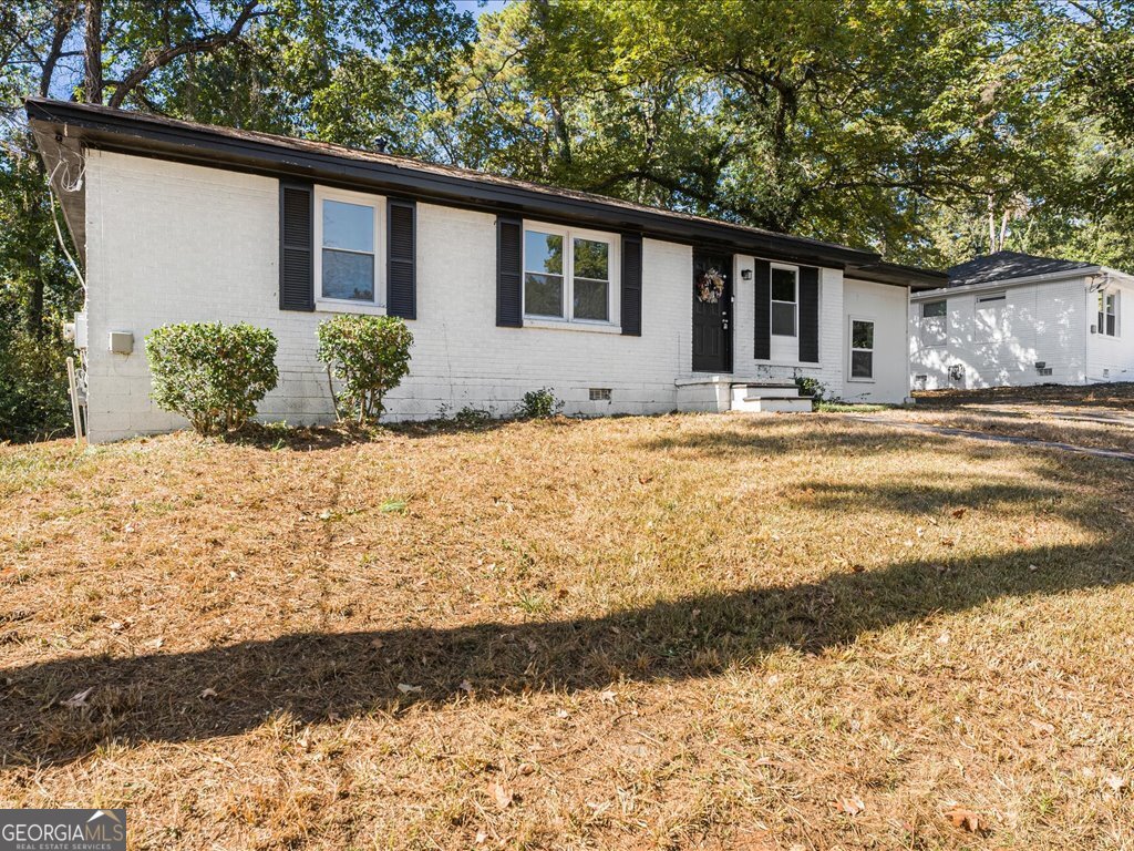 2905 Gresham Rd S East Atlanta, GA 30316 - Photo 5 of 27 a front view of a house with a yard