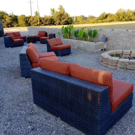 a view of a tables and chairs in back yard of the house