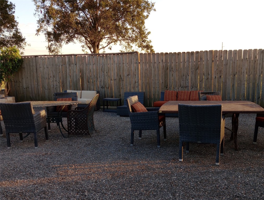 44537 Old Houston Highway Prairie View, TX 77484 - Photo 13 of 14 a view of a tables and chairs in back yard of the house