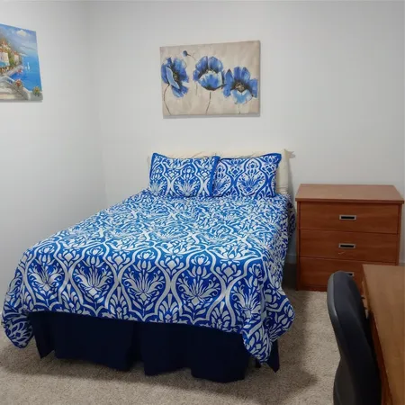 a bed sitting in a bedroom next to a small yard