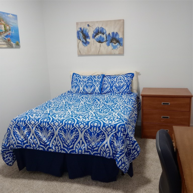 44537 Old Houston Highway Prairie View, TX 77484 - Photo 4 of 14 a bed sitting in a bedroom next to a small yard