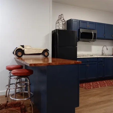 a kitchen with stainless steel appliances a refrigerator and a stove