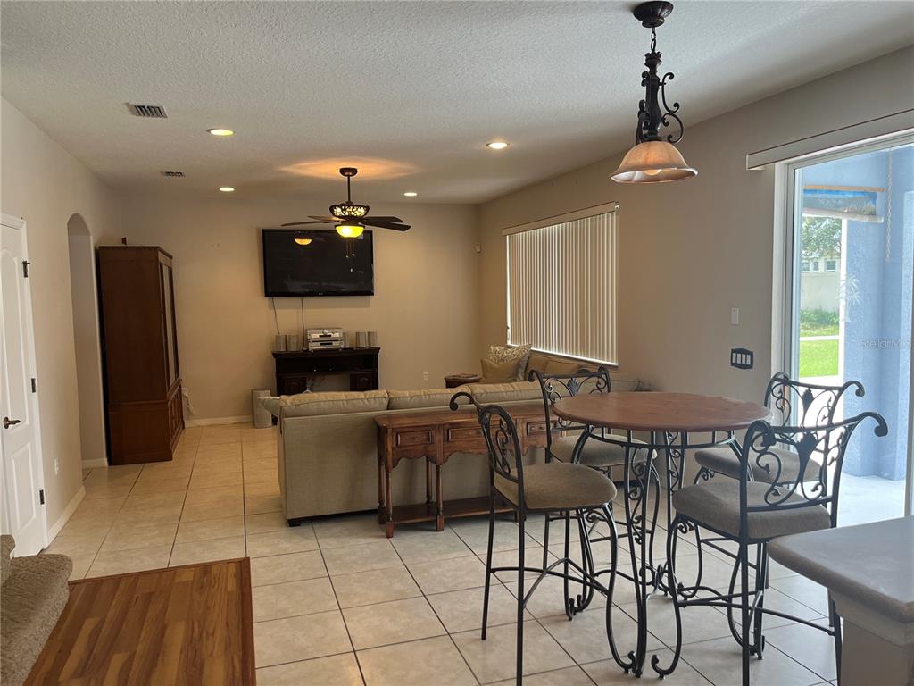 5966 Willows Bridge Loop Ellenton, FL 34222 - Photo 15 of 57 a living room with furniture and a flat screen tv
