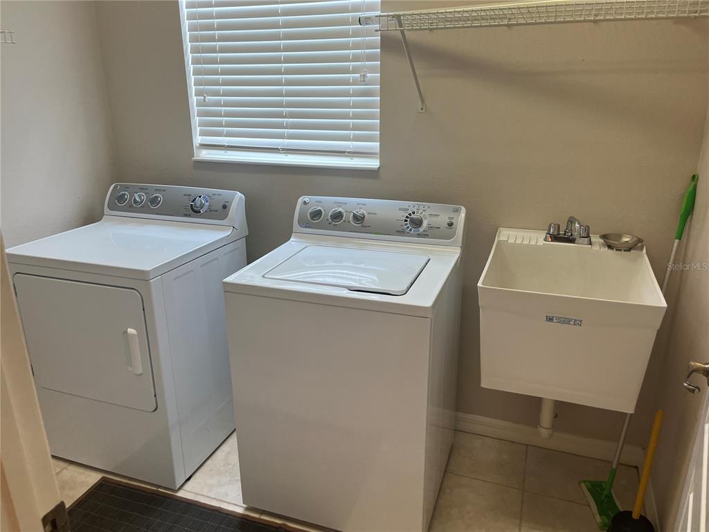 5966 Willows Bridge Loop Ellenton, FL 34222 - Photo 17 of 57 a utility room with dryer and washer