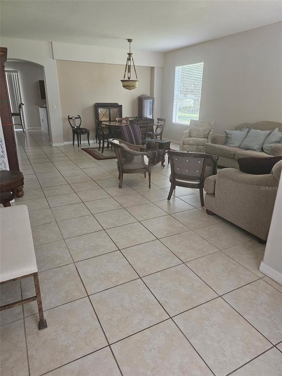 5966 Willows Bridge Loop Ellenton, FL 34222 - Photo 20 of 57 a living room with furniture a dining table and a window