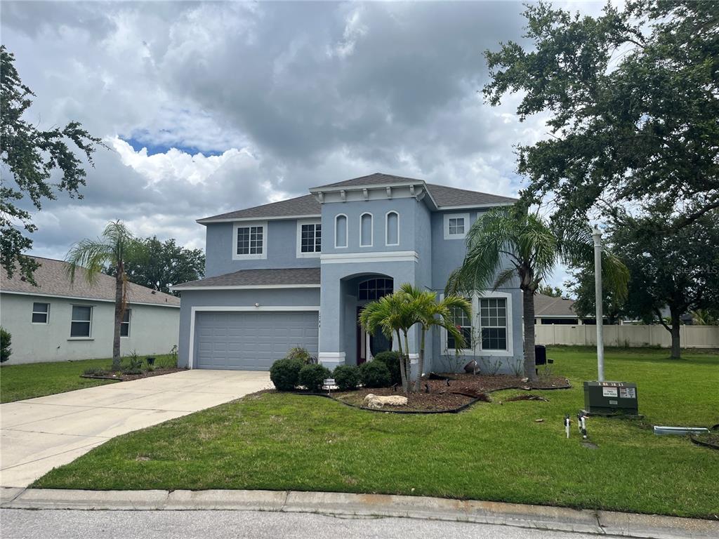5966 Willows Bridge Loop Ellenton, FL 34222 - Photo 2 of 57 a front view of house with yard and green space