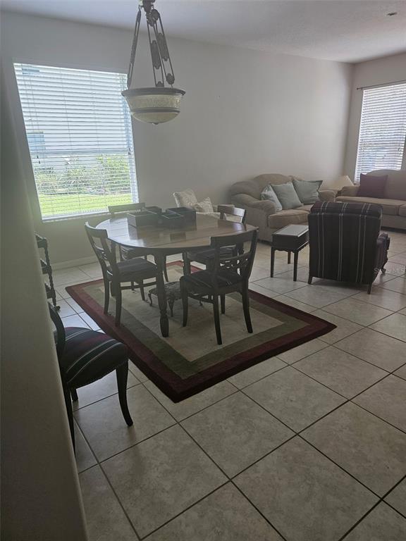 5966 Willows Bridge Loop Ellenton, FL 34222 - Photo 22 of 57 a view of a dining room with furniture and window