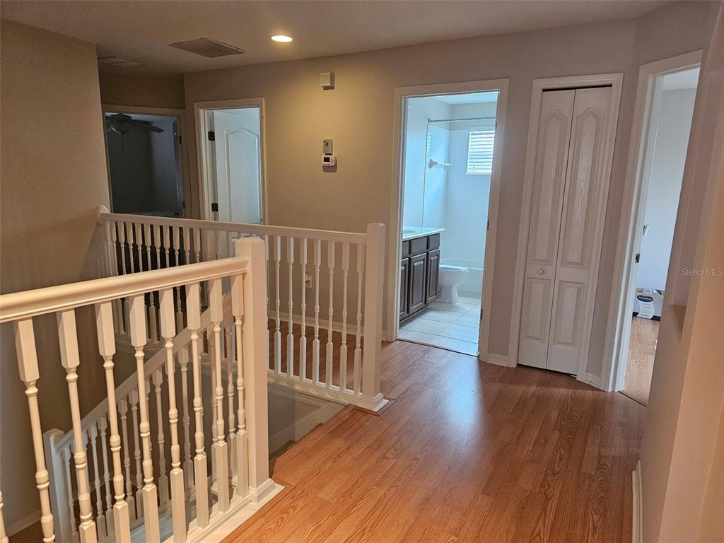5966 Willows Bridge Loop Ellenton, FL 34222 - Photo 24 of 57 a view of a hallway with wooden floor and a bathroom