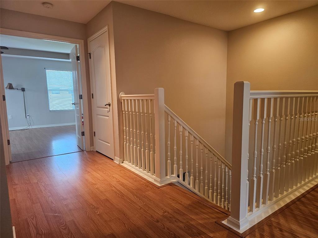 5966 Willows Bridge Loop Ellenton, FL 34222 - Photo 25 of 57 a view of a hallway with wooden floor