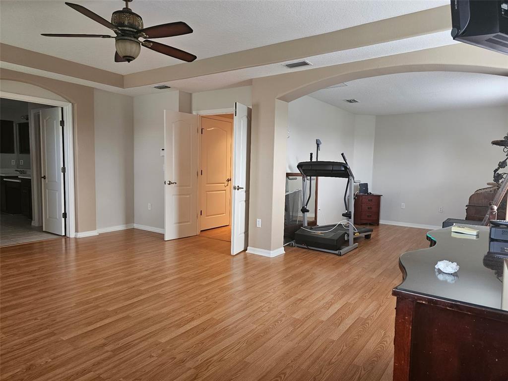 5966 Willows Bridge Loop Ellenton, FL 34222 - Photo 27 of 57 a view of a workspace with wooden floor and windows