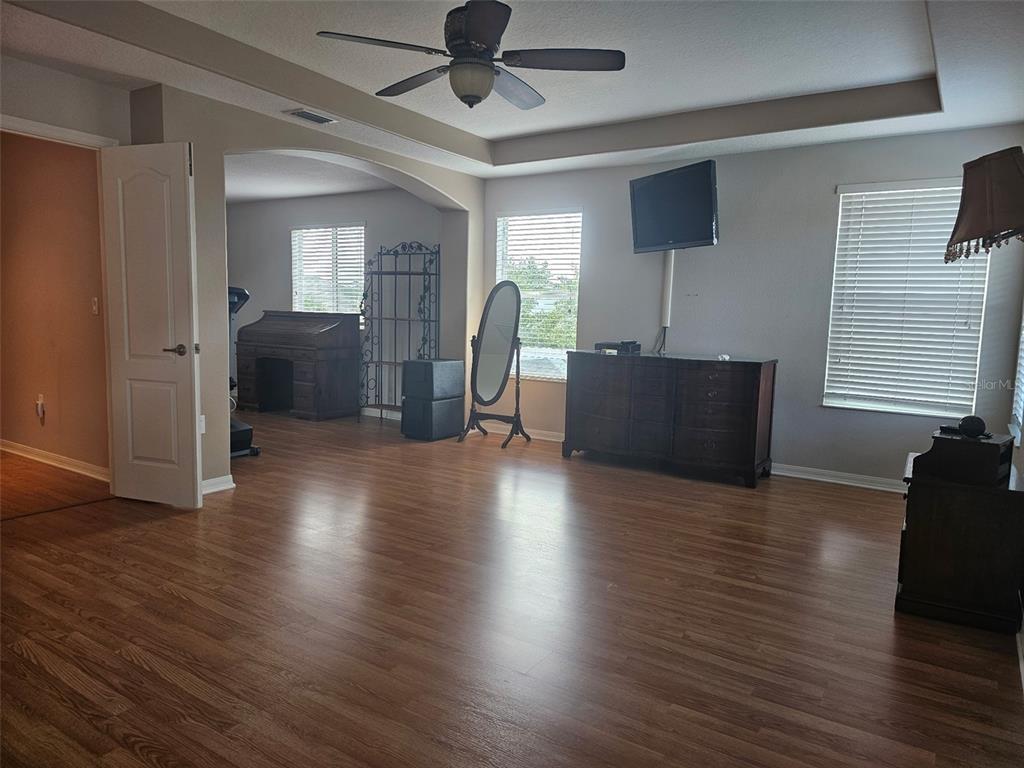 5966 Willows Bridge Loop Ellenton, FL 34222 - Photo 28 of 57 a view of a livingroom with furniture hardwood floor and a ceiling fan