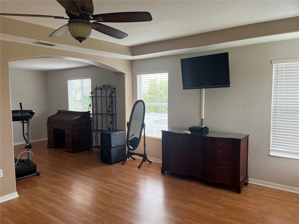 5966 Willows Bridge Loop Ellenton, FL 34222 - Photo 29 of 57 a living room with furniture and a flat screen tv